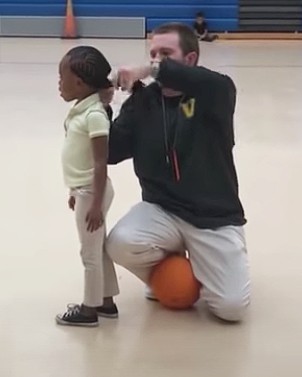 A coach goes viral for the sweetest act during a children’s basketball game