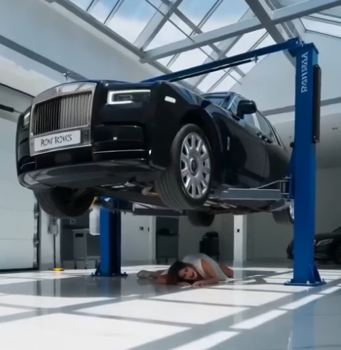 Her hands were tied behind her back, and she was lying on the concrete floor, directly beneath a hydraulic car lift.