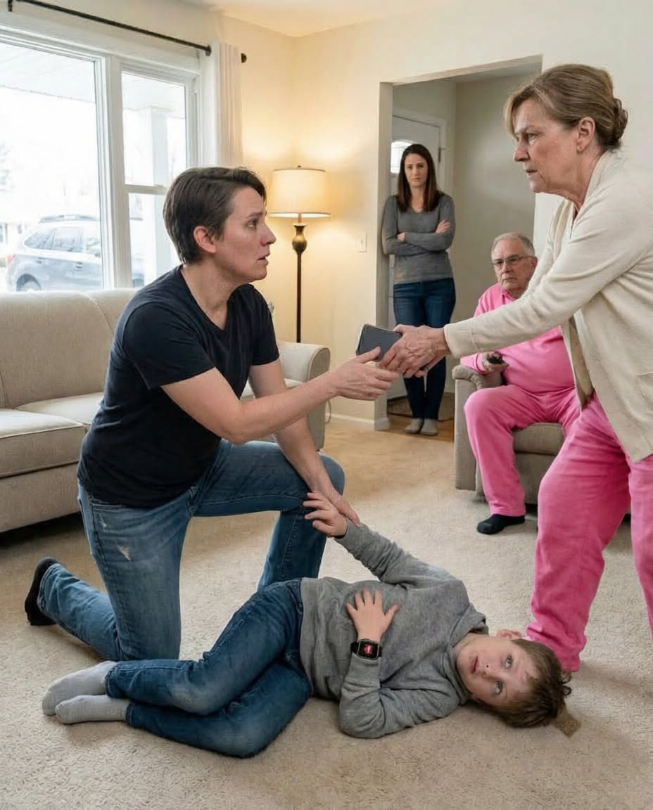 My eight-year-old son lay gasping on my parents’ floor after his twelve-year-old cousin’s beating fractured one of his ribs. When I reached for my phone to call 911, Mom snatched it away. “Boys fight. Don’t ruin your nephew’s future.” Dad barely looked up. “You’re overreacting.” My sister only smirked. I stopped pleading when I noticed the red SOS light blinking on my son’s smartwatch. It had already transmitted eleven minutes of audio and our location to emergency dispatch. When the first officer repeated Mom’s exact words, my sister’s smile disappeared.