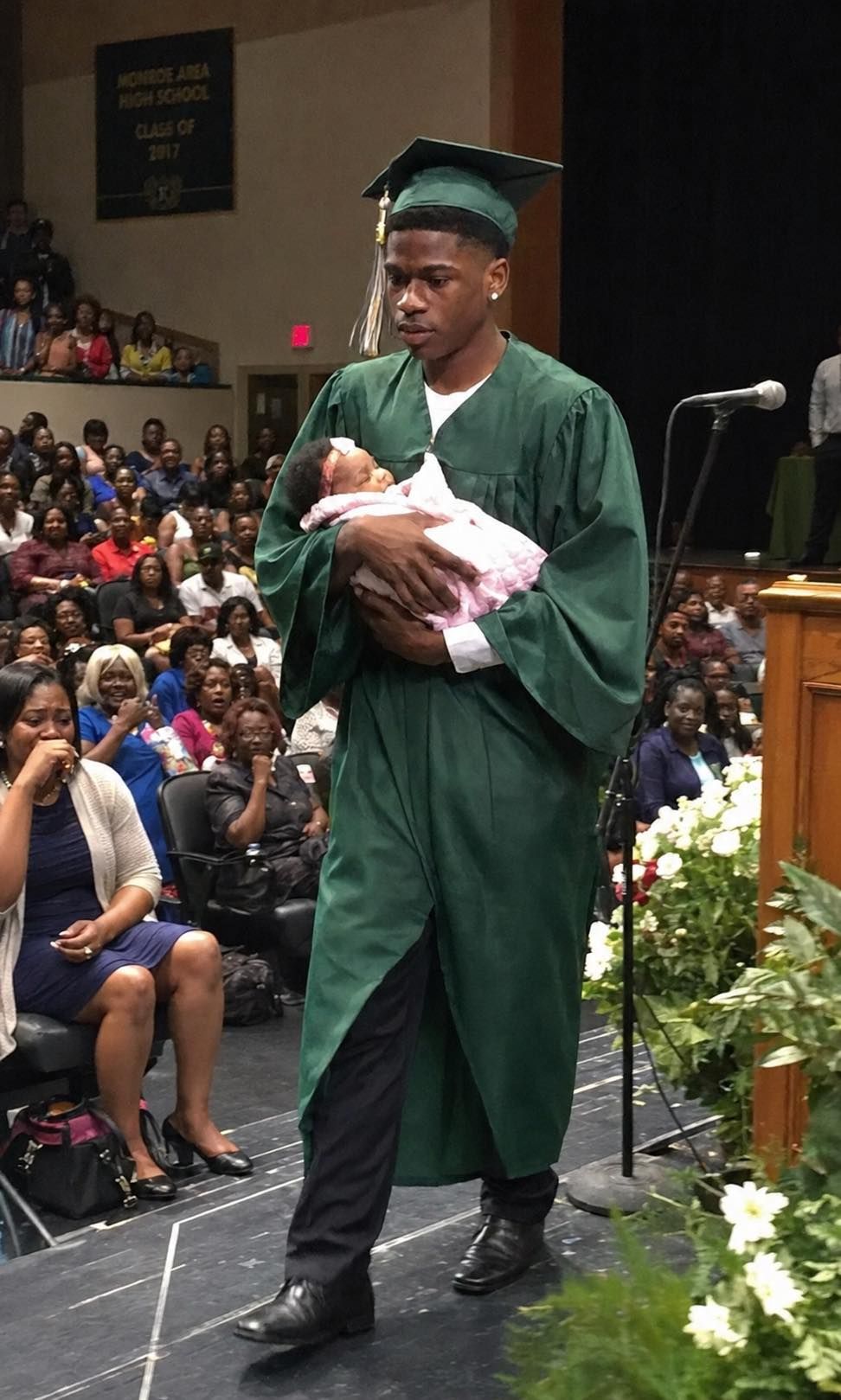 They laughed when my son stepped onto the graduation stage with a newborn in his arms. Someone behind me even whispered, “Just like his mother…”