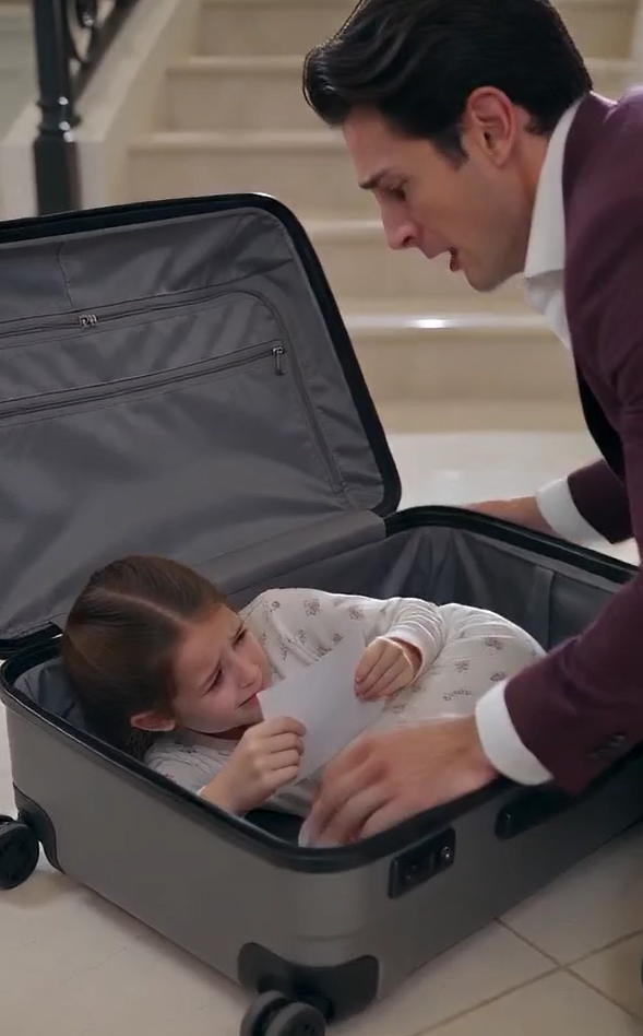 A terrified six-year-old girl is pounding from inside a locked hard-shell suitcase in a Connecticut mansion.