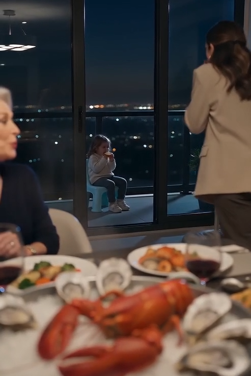 I found our three-year-old daughter sitting alone on the balcony with a stale bread roll while six adults enjoyed a lavish seafood dinner—paid for with my salary.