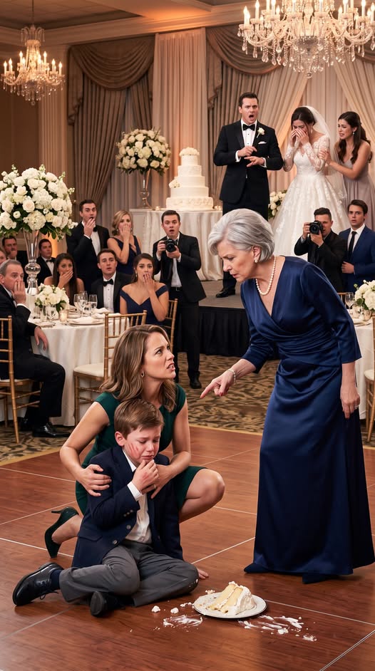 My six-year-old son picked up a single piece of wedding cake, smiling like every other child in the room. Then my mother-in-law slapped him so hard he crashed onto the marble floor. “Greedy little brat!” she screamed. As I rushed to hold him, he looked up through tears and whispered, “Mom... Grandma said I’m not really family.” Five minutes later, the groom called off the wedding—and everyone finally understood why.
