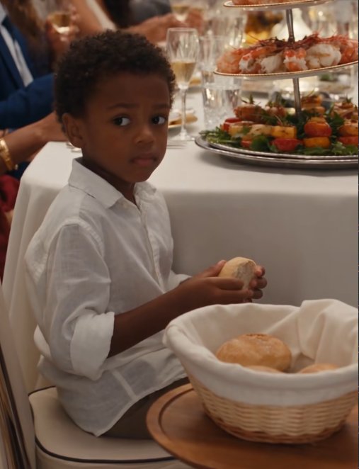 My son sat at a table near the kitchen holding a piece of stale bread while my sister's dog ate prime steak six feet away.