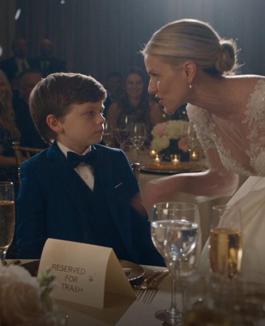 At my sister’s wedding, my 8-year-old son’s seat was labeled “RESERVED FOR TRASH.” She called it a joke—until I took his hand and walked out.