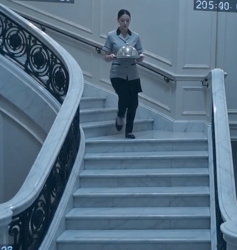 The maid carried the silver tray down the staircase exactly as she had claimed.  Then everyone saw it.  Her heel caught the edge of her own dress.