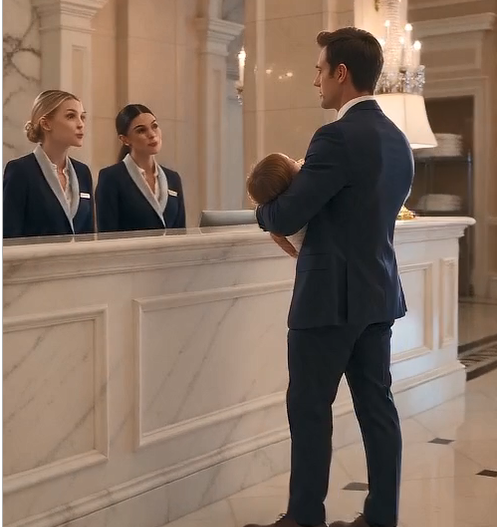 The receptionist’s fingers froze above the keyboard.  “Suite 904… executive corporate reservation…” she repeated, as if the words might change if she said them differently.  My daughter shifted slightly in my arms. I lowered my voice instinctively, keeping her asleep.  “Yes,” I said calmly. “That should be the room.”