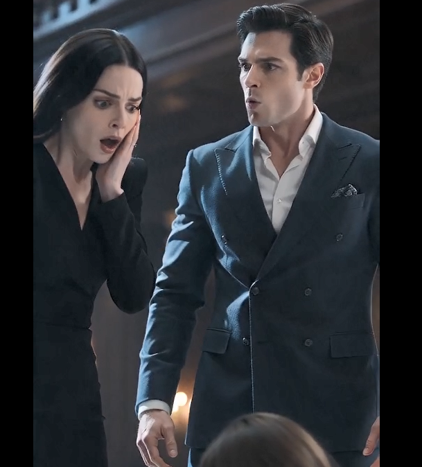 Julian’s grip on Mara’s hand was an anchor in the spinning room. As she found her footing, the heavy wool of his overcoat settled around her shoulders, carrying the faint, crisp scent of winter air and cedar. He kept his arm firmly around her waist, shielding her swollen belly from the surrounding crowd.