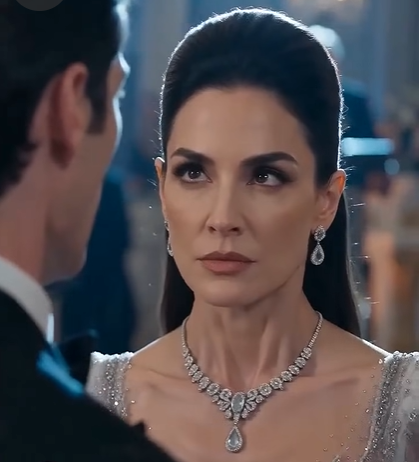 The chandeliers of Sterling Manor flickered, reflecting the cold, calculating glare of the federal marshals as they hauled Adrian away. But my vision had tunneled down to a single focal point: the young woman standing near the entryway, holding up a silver bracelet etched with an ivy leaf.