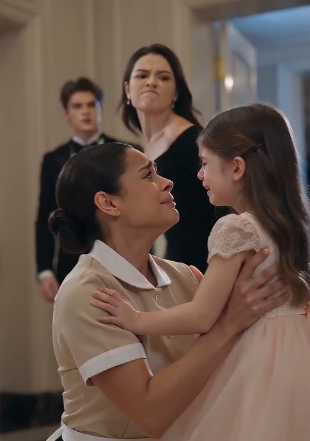 A glamorous charity ball came to a halt when a little girl in a pink dress suddenly ran across the ballroom.