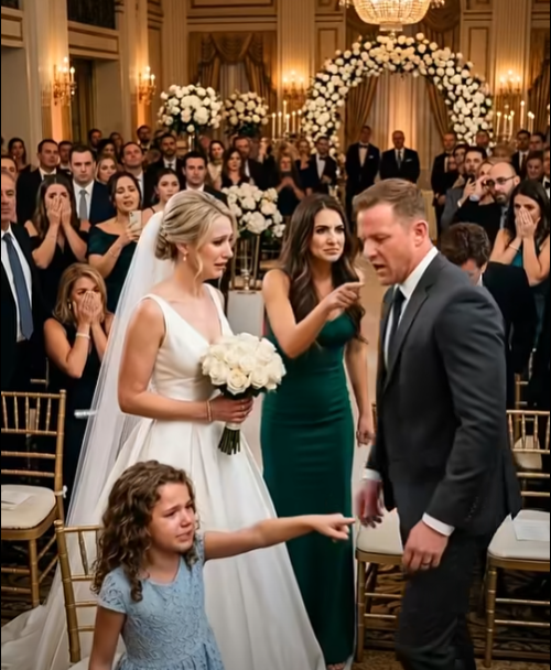 The entire ballroom went silent.  One hundred and twenty guests stared at a nine-year-old girl standing beside a row of white chairs.  Lily's small hands trembled at her sides.  But she didn't sit down.  She didn't look away.  And she didn't seem scared of her mother.  Vanessa's smile vanished instantly.  "Lily," she snapped. "Sit down."  "No."