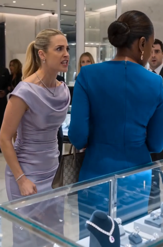 THE WOMAN IN THE NAVY DRESS