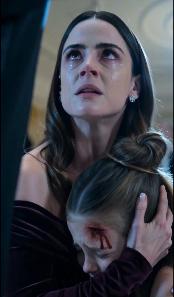 CHAPTER 2 — THE FOOTAGE THAT DIDN’T LIE  We were moved into a side security room.  White walls. Cold monitors. No chandeliers. No guests.  Just screens.  Sophie was now on a stretcher, still conscious, clutching my hand.  A paramedic pressed gauze gently to her head.  “Stay with me, sweetheart,” I whispered.  Behind us, Preston was seated.  Still composed.  Still pretending.  Then the footage loaded.  The ballroom appeared on screen.  High angle.  Clear.  Unforgiving.  We watched Preston walk to our table.  We watched him reach into Sophie’s jacket.  We watched the phone appear in his hand.  But then—  The system zoomed.  Security enhancement mode.  And another angle appeared.  Preston standing near the table earlier.  Placing something into the pocket.  Slowly.  Deliberately.  A planted setup.  The room went silent.  Even my mother stopped breathing.  The security officer didn’t react emotionally.  He just said one line:  “Tampering with evidence. That’s intentional framing.”  Preston finally stood up.  “No,” he said quickly. “That’s edited.”  But the officer shook his head.  “There’s timestamp redundancy across three independent feeds.”  That’s when I saw it.  The moment everything inside Preston cracked.  Not anger.  Not denial.  Fear.  For the first time in his life—  No one was protecting him.