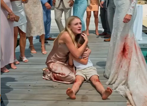 My four-year-old daughter had just fallen onto the dock. Her bare legs were bruised, filthy, and shaking while guests stared from beneath the wedding lights.