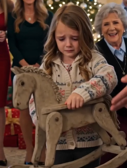 Grandfather Robert shoved the battered wooden rocking horse into Josephine’s arms while laughter rolled around the Christmas tree.