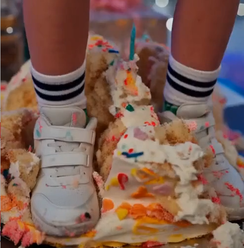 He came down with both sneakers in the middle of William’s burning birthday cake.