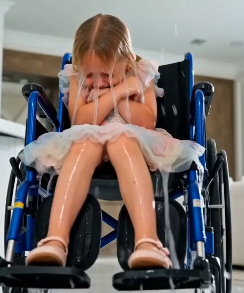 The Fiancée pours an entire pitcher of ice water over four-year-old Ilaria, leaving her soaked and violently trembling in her wheelchair.