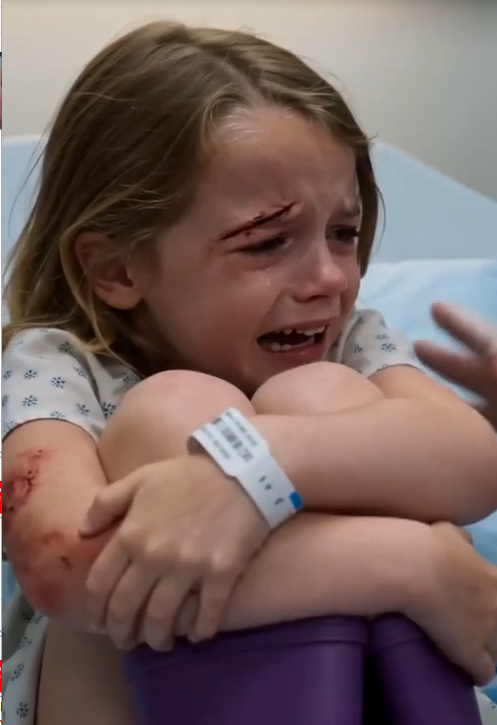 Lily was kicking so violently that both purple rain boots hammered against the hospital bed.