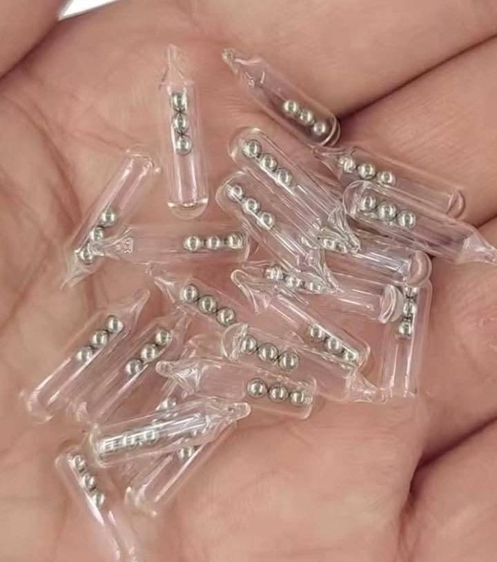 Identifying Small Glass Tubes Containing Threes Tiny Ball Bearings