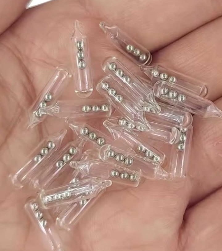 Identifying Small Glass Tubes Containing Three Tiny Ball Bearings