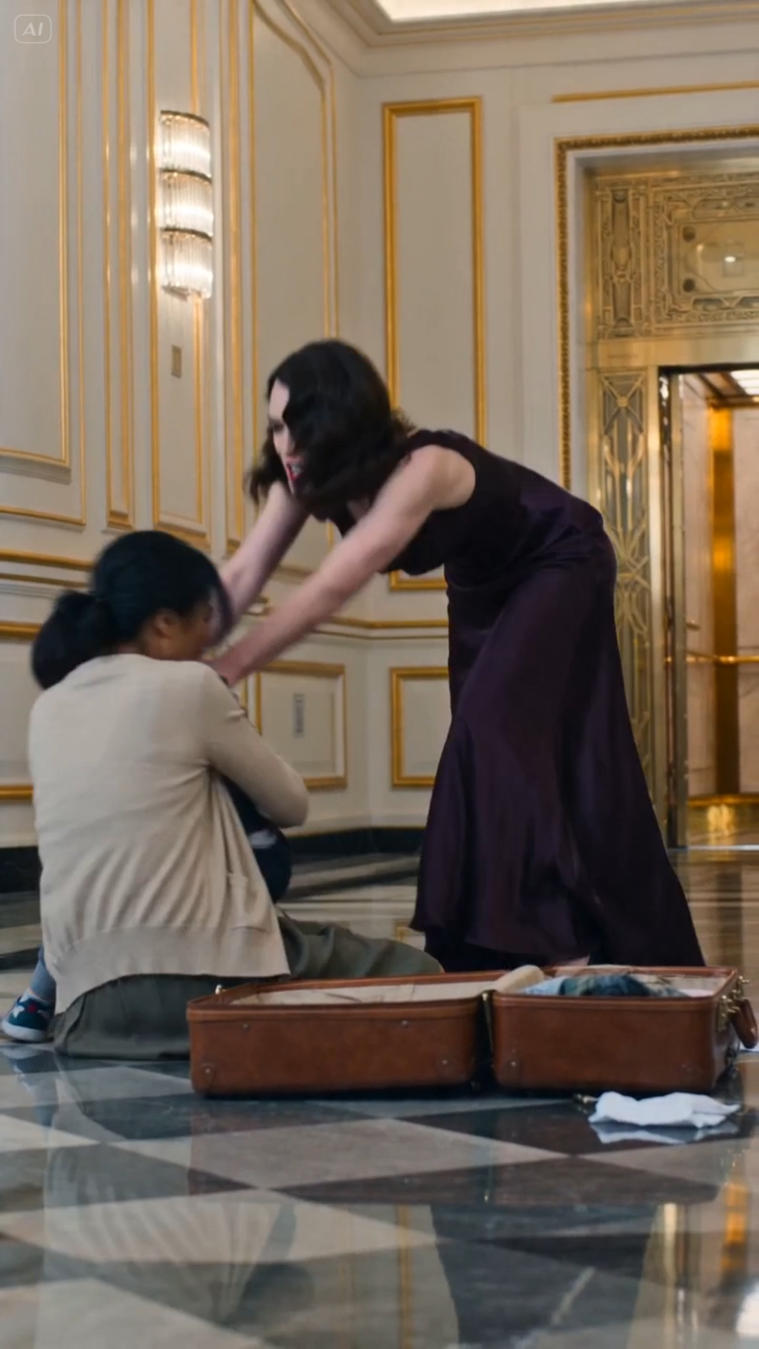 PART 2:  The suitcase collided with the polished marble with a sound like a gunshot, the leather latch snapping violently to splay open. Before the child could even register the shock, his world was exposed—t-shirts, worn notebooks, and a small, battered toy car skittered across the pristine floor of the five-star hotel lobby.