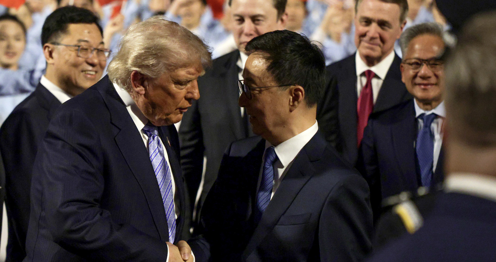 Trump Gets Off Plane in China with Surprise Guest Behind Him— China Is NOT Happy
