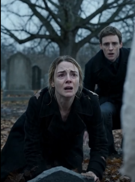 The mother was kneeling in the wet leaves, her black coat pressed against the ground, her face buried in her shaking hands.