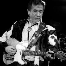 Buck Owens’ Spirited Performance in “Act Naturally”