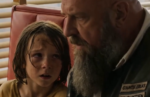 PART 2: The little girl appeared beside the biker’s booth so quietly that he didn’t notice her until a tiny hand tugged at the edge of his leather vest.