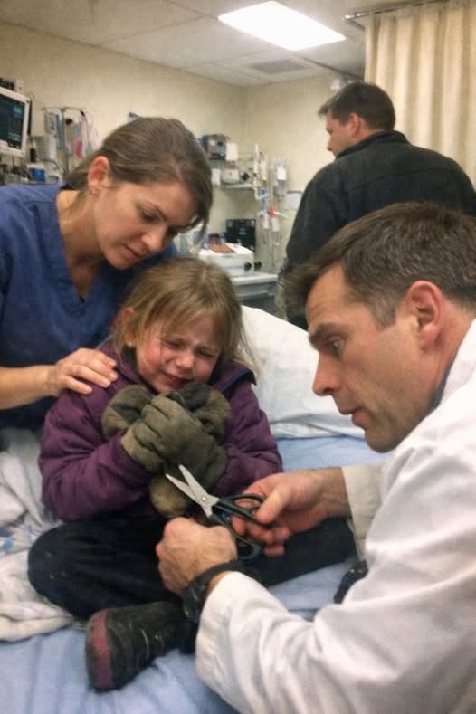 “Please… don’t take them off… he said the bad will come out…” — The terrified whisper of a seven-year-old girl in the ER made my hands freeze mid-motion, because moments later, when we cut through her gloves, what we found hidden inside wasn’t just an injury… it was something no child should ever have to carry, and it exposed a truth that would change everything I thought I understood about fear.
