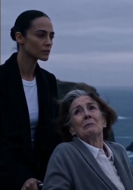 A woman pushed her disabled mother-in-law toward the edge of a cliff at sunset… then headlights suddenly appeared behind them.