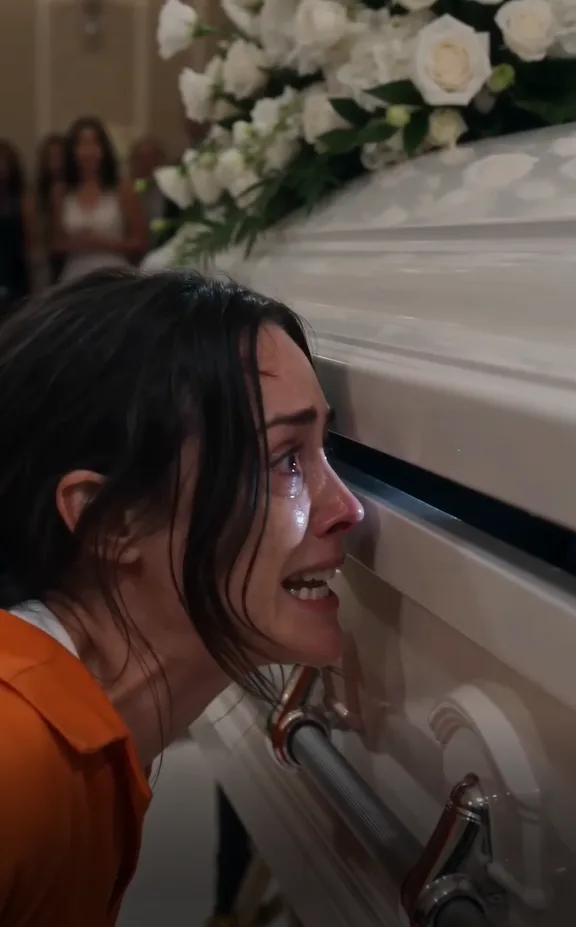 The wedding guests screamed when a woman in an orange prison uniform burst into the ballroom.
