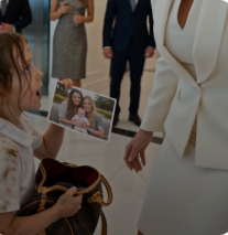 The little girl slid violently across the polished marble floor, both tiny hands wrapped around the strap of an expensive designer bag.