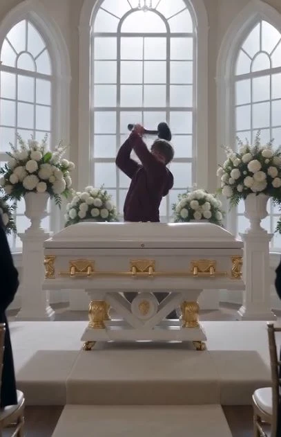 The crystal chandelier cast a cold, haunting light over the extravagant floral arrangements of the most expensive funeral in the city.