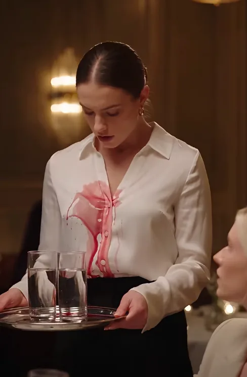 She smiled into her phone as red wine poured down the front of my white shirt