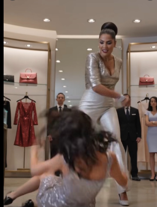 A routine trip to a luxury boutique turns into a nightmare when the wealthy, entitled Isabella brutally assaults fifteen-year-old Ana. The violence is cut short when Mr. Vega violently crashes his matte-black SUV through the storefront to rescue his daughter.