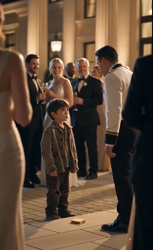 The waiter’s hand struck the boy’s bread so violently that the small child recoiled as if he had been hit.  The piece of bread flew across the stone pavement outside the luxurious wedding hall, rolling into the dirt.