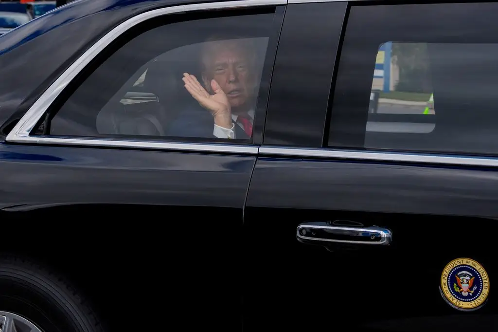 Donald Trump emerges from the White House after controversial Easter message