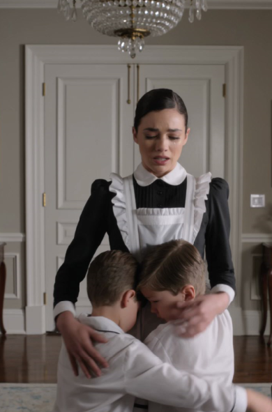 The boys were holding the maid like they were afraid someone would rip her away.