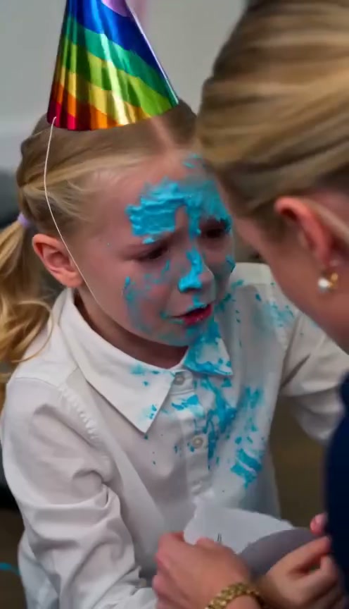 The birthday cake hit Sophie’s face so hard that she fell backward into a chair.