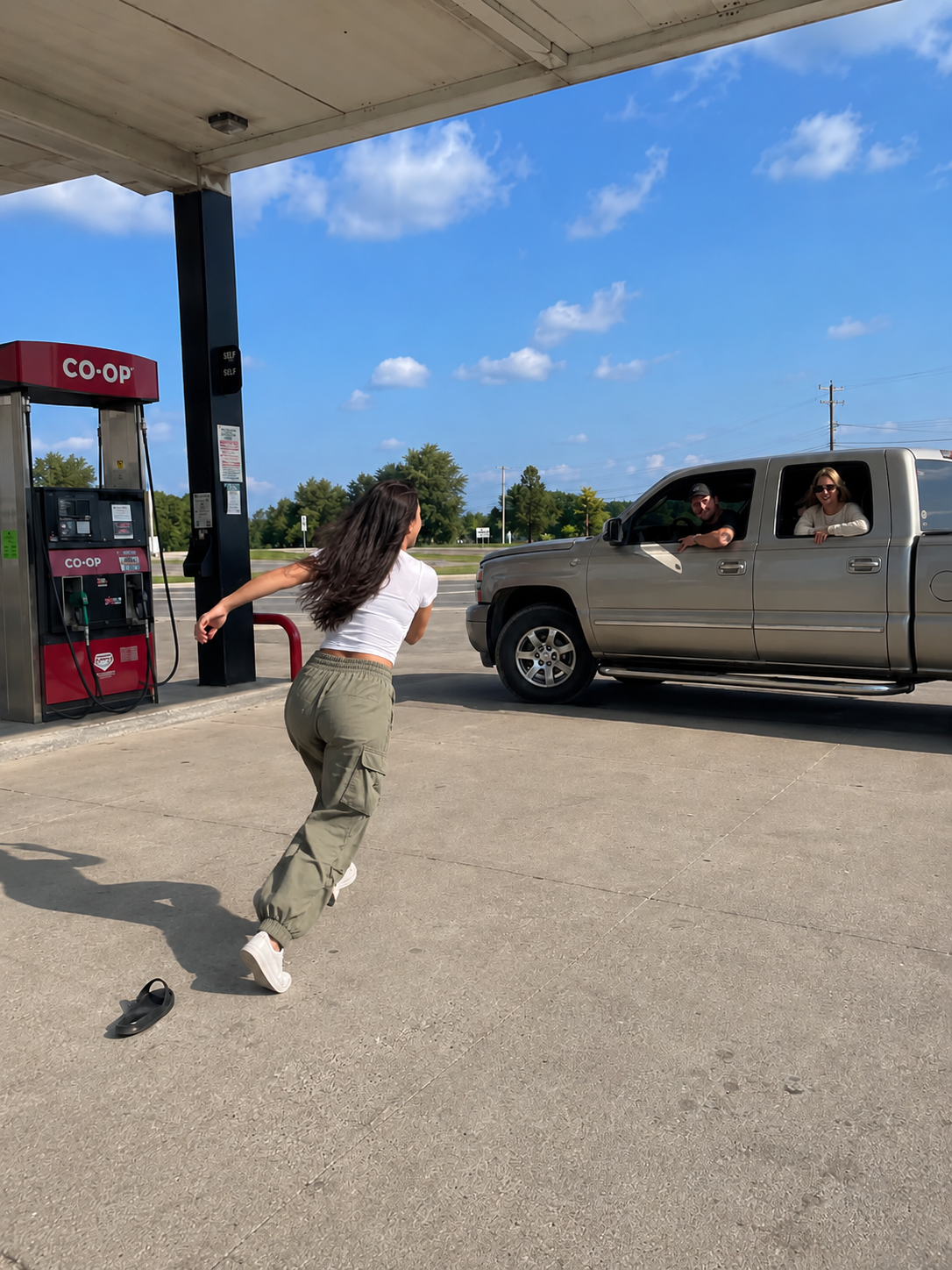 THE WOMAN AT THE GAS STATION