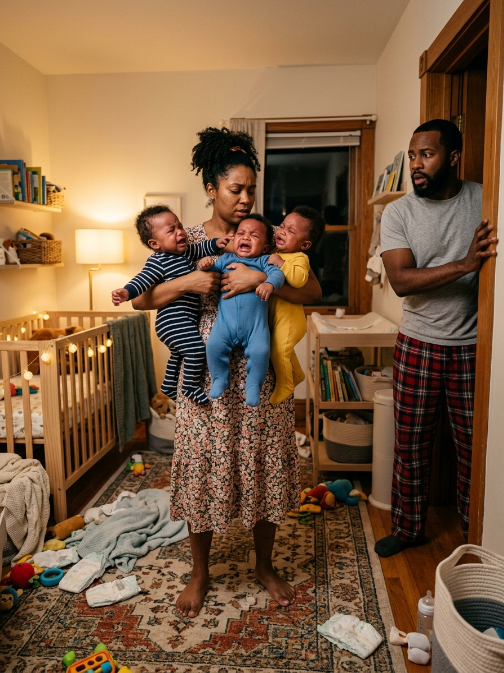 The businessman found the cleaner holding all four babies at 3 a.m.—and finally realized why his mansion had been crying for months.