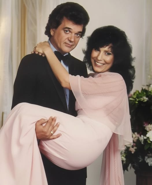 When Loretta Lynn and Conway Twitty sing “Louisiana Woman, Mississippi Man,” they’re not just telling a love story — they’re living it. With Loretta’s fiery sass and Conway’s smooth southern charm, this duet bursts with chemistry, passion, and the unstoppable pull between two hearts separated by a river… but never by love.