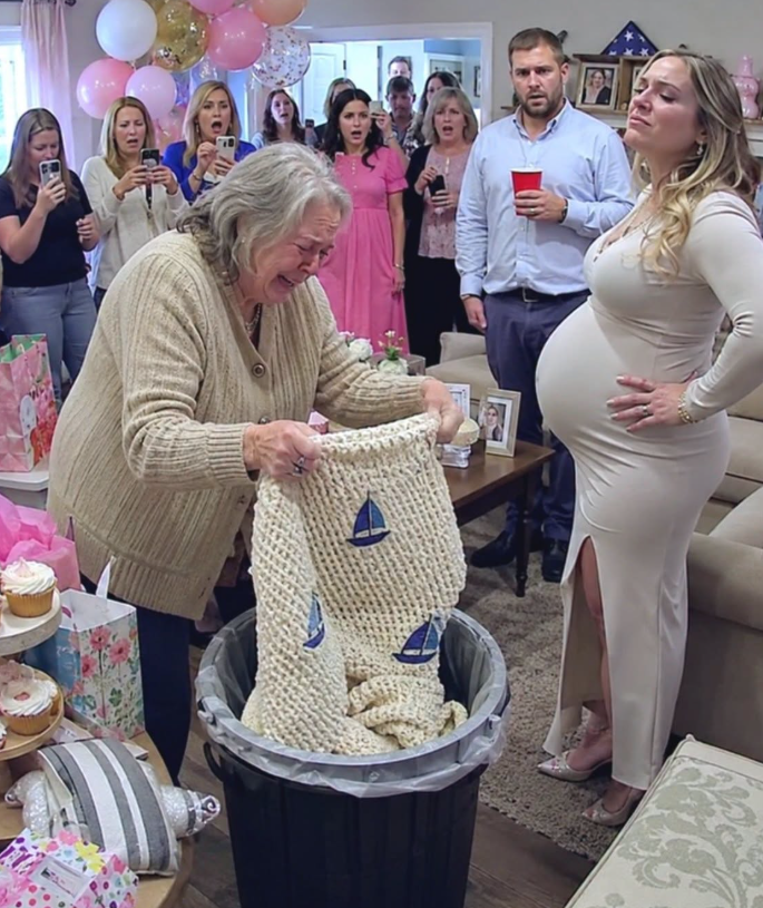 At my grandson’s baby shower, my daughter-in-law tossed my hand-knitted blanket in the bin: "We only use designer things here." — I fished it out and brought it home without arguing. That night my son called, voice breaking: "Mom... What was folded inside that blanket?"