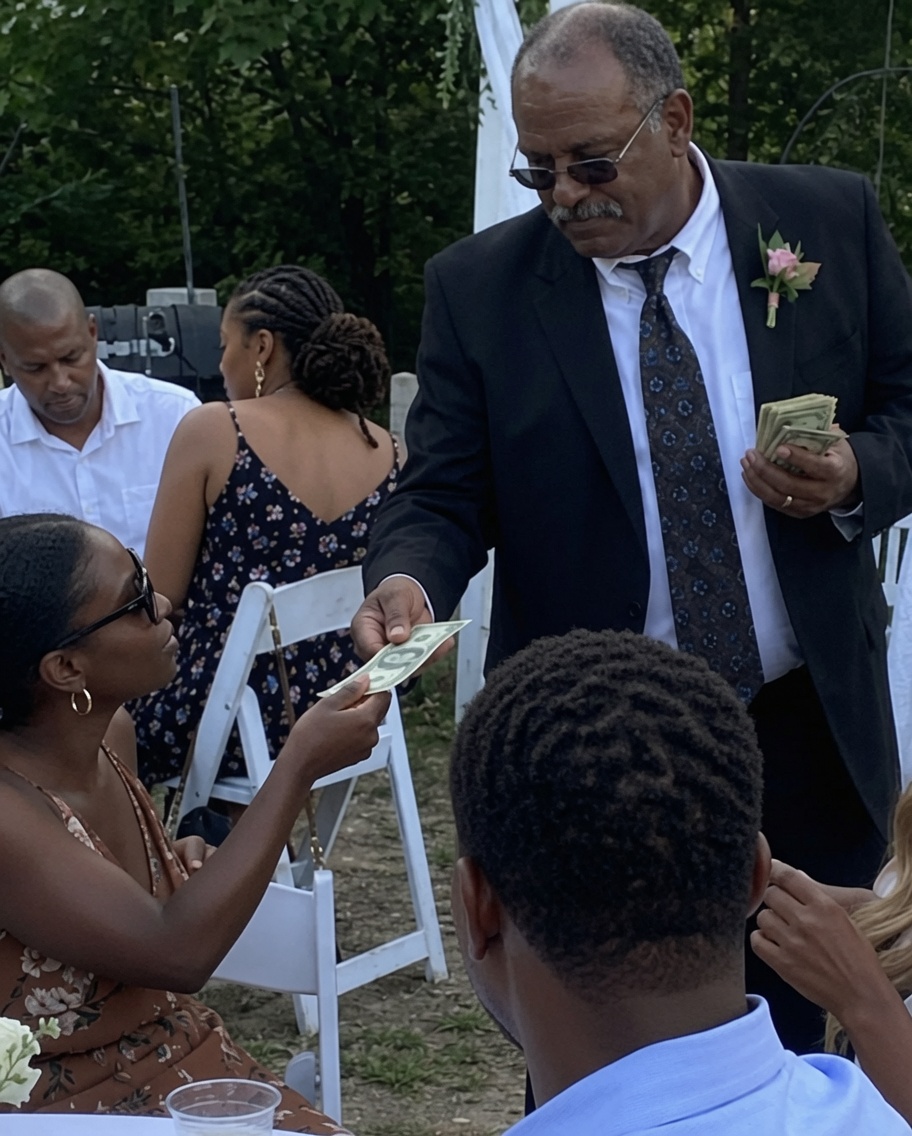 When I Got My Wedding Photos Back, I Noticed My Dad Secretly Handing Guests $1 Bills.