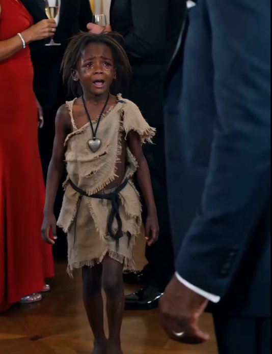 The little girl didn't belong in the ballroom.