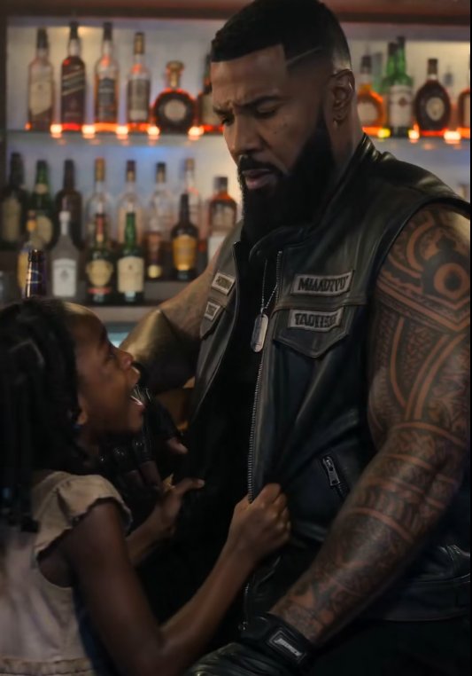 The biker bar fell silent when the front door opened.
