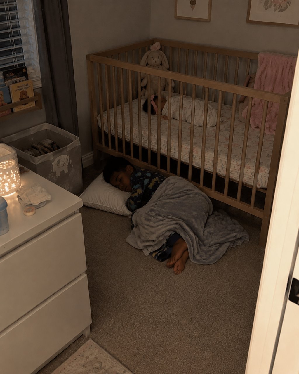 My 7-year-old son began sleeping under his newborn sister's crib — when I overheard what he whispered to her at 2 A.M., I went pale.