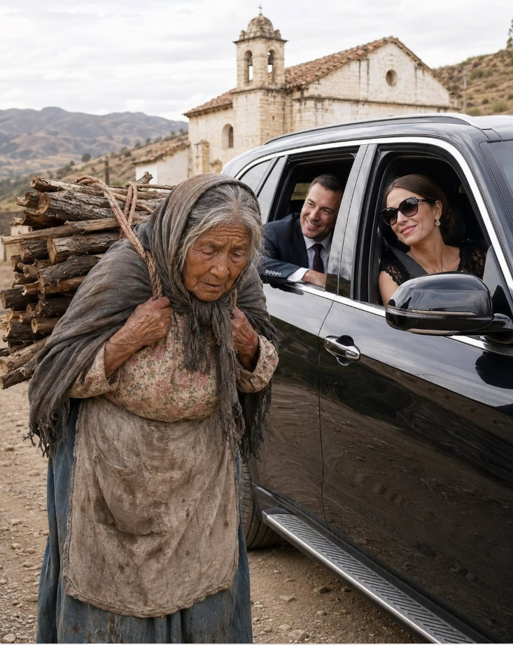 An elderly woman moved slowly down a dusty road, bent beneath a heavy bundle of firewood strapped across her back, while a rich couple inside a luxury SUV m0cked her through the window. She kept walking without a word until, very slowly, she turned her face toward them. The man’s expression went completely still.