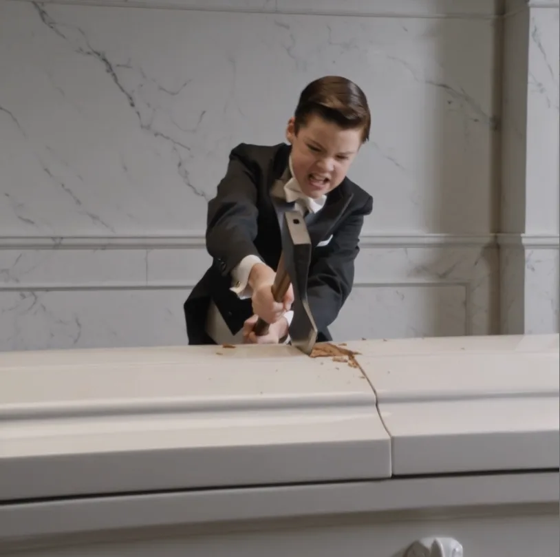 Smashing a white coffin with an axe in a frantic rage, the little boy ignored the man pointing a gun at him, only to uncover a horrifying family secret hidden inside.